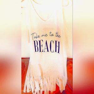 Beach cover-up in white with black writing that says "Take me to the beach"